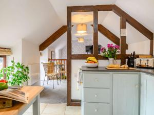 a kitchen with a counter with fruit on it at 1 bed in St Briavels 88814 in Saint Briavels