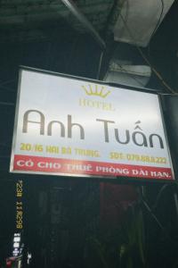 a sign for anah tour hanging on a building at Anh Tuấn Motel in Hue