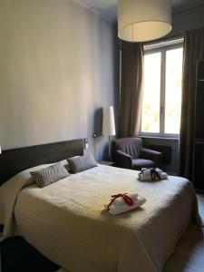 Postel nebo postele na pokoji v ubytování Corridoni Suites