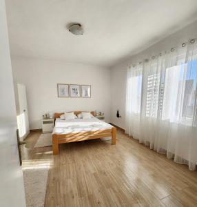 Postel nebo postele na pokoji v ubytování Apartmani Vidakovic