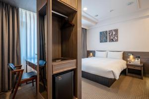 Postel nebo postele na pokoji v ubytování Dream Mansion Hotel