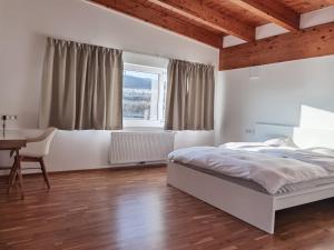 Postel nebo postele na pokoji v ubytování BeeHome Apartment