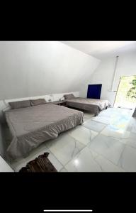 Letto o letti in una camera di Nest Jungle