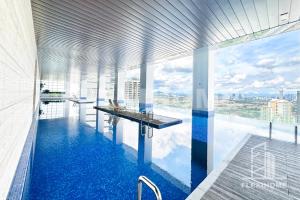 a pool in a building with a view of the city at 1-5 Guests, 2BR Family Home, Azure Residences PJ-Beside Paradigm Mall - Flexihome MY in Petaling Jaya