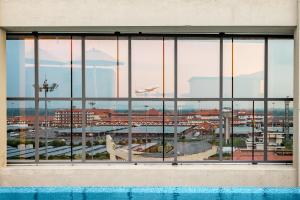 a view of the city from a window in a building at PRESIDENCY AIRPORT HOTEL in Cochin