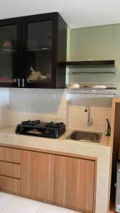 Η κουζίνα ή μικρή κουζίνα στο Apartemen Akasa BSD 1 Bedroom