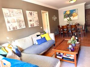 a living room with a couch and a table at La Quinta Suite Home Share in Santa Úrsula