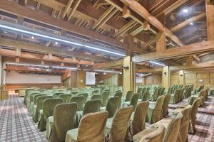 an empty lecture hall with rows of chairs at Pirin Golf Hotel & Spa in Bansko +51 photos