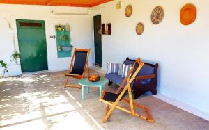 a living room with a couch and a table at Agritourism Cottage near Sitia (Henhouse) in Sitia