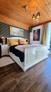 Postel nebo postele na pokoji v ubytování Landhaus Osborne