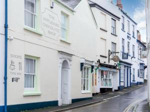 a row of white buildings on a street at 2 Bed in Appledore 63084 in Appledore