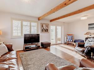 a living room with a couch and a flat screen tv at 3 bed in Camber 72303 in Camber