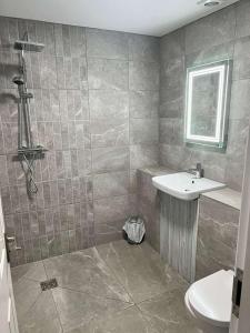 a bathroom with a sink and a toilet at The Dunes Hotel in Barrow in Furness