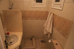 Koupelna v ubytování Amon Hotel
