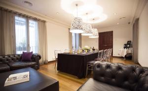 a dining room with a table and chairs at Hospes Puerta de Alcalá, a Member of Design Hotels in Madrid