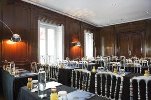 a conference room with tables and chairs in it at Hospes Puerta de Alcalá, a Member of Design Hotels in Madrid +37 photos