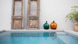 two vases sitting on a ledge next to a window at Charming villa in Radetići in Tinjan
