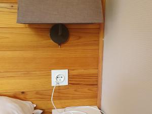 a headboard of a bed with a electrical outlet at Appartement Saint-François-Longchamp, 3 pièces, 6 personnes - FR-1-635-71 in Saint-François-Longchamp