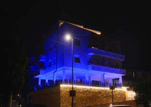 a building with blue lights on it at night at Serenity Suite in Montecatini Terme