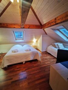 a bedroom with two beds in a attic at Penthouse between lake, Ouchy and city center in Lausanne