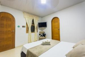 Letto o letti in una camera di Hotel Real Guatapé