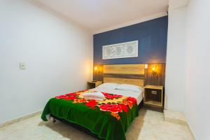 Letto o letti in una camera di Hotel Real Guatapé