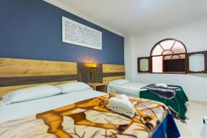 Letto o letti in una camera di Hotel Real Guatapé