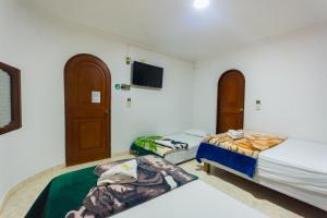 Letto o letti in una camera di Hotel Real Guatapé