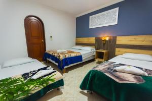 Letto o letti in una camera di Hotel Real Guatapé