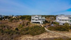 an aerial view of a house on a hill at Cypress Hall in Holden Beach