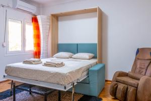 Ліжко або ліжка в номері Rania's home in Athens center