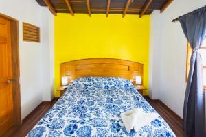 Letto o letti in una camera di Hotel Real Guatapé