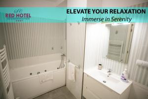 a white bathroom with a tub and a sink at Red Hotel Riviera Suite&Lake in Cluj-Napoca +28 photos