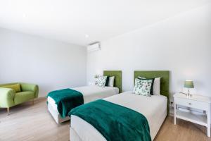 En eller flere senge i et værelse på Altura Dreams + 37 billeder