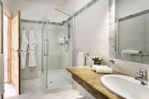 a bathroom with a sink and a shower at Resort Cala Di Falco in Cannigione +52 photos