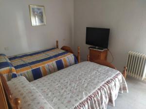 Säng eller sängar i ett rum på Room in Holiday house - Habitacion Privada Doble Toledo