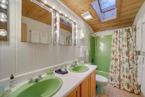 a bathroom with a green sink and a toilet at Stunning Cashiers Vacation Home with Mountain Views! in Cashiers +37 photos