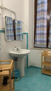 a bathroom with a sink and a mirror at Casa di Chiara in Crotone