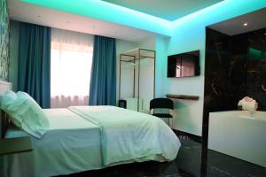 Postel nebo postele na pokoji v ubytování Hotel Max