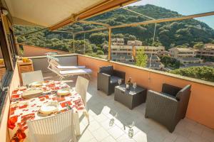 a balcony with a table and chairs and a view at Giglio Rosa 4 n9 in Campese
