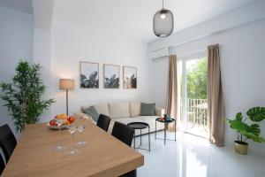 a living room with a table and a couch at SingularStays Tinglado in Valencia +34 photos