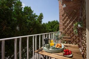 a tray of food on a table on a balcony at SingularStays Tinglado in Valencia