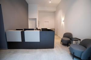 Ein Sitzbereich in der Unterkunft Be Mate Torino Centro