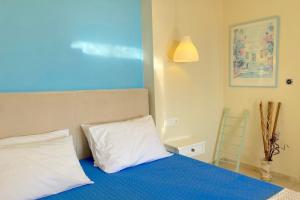 Katil atau katil-katil dalam bilik di Nissaki Suite Artemis Apartment by Sealand Villas +12 gambar