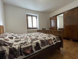 Postel nebo postele na pokoji v ubytování 061 Bilocale Mansarda, Carisolo