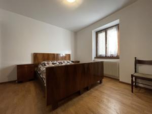 Postel nebo postele na pokoji v ubytování 061 Bilocale Mansarda, Carisolo
