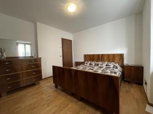 Postel nebo postele na pokoji v ubytování 061 Bilocale Mansarda, Carisolo