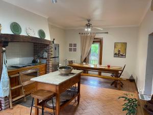 a kitchen with a table and a dining room at Quintinha da Bé, Ourém, Portugal in Ourém