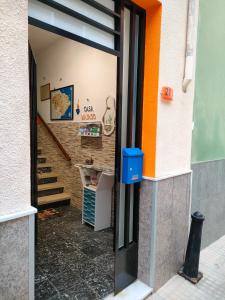 a door to a building with a staircase in it at Casa Mayago, terraza y solárium in Pego