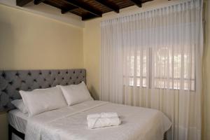 Giường trong phòng chung tại Finca Villa Isanella, Santuario, Antioquia